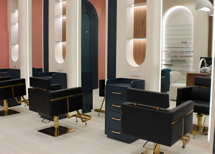 Modern interior of Elysian Salon in Riyadh features chic black chairs and elegant decor.