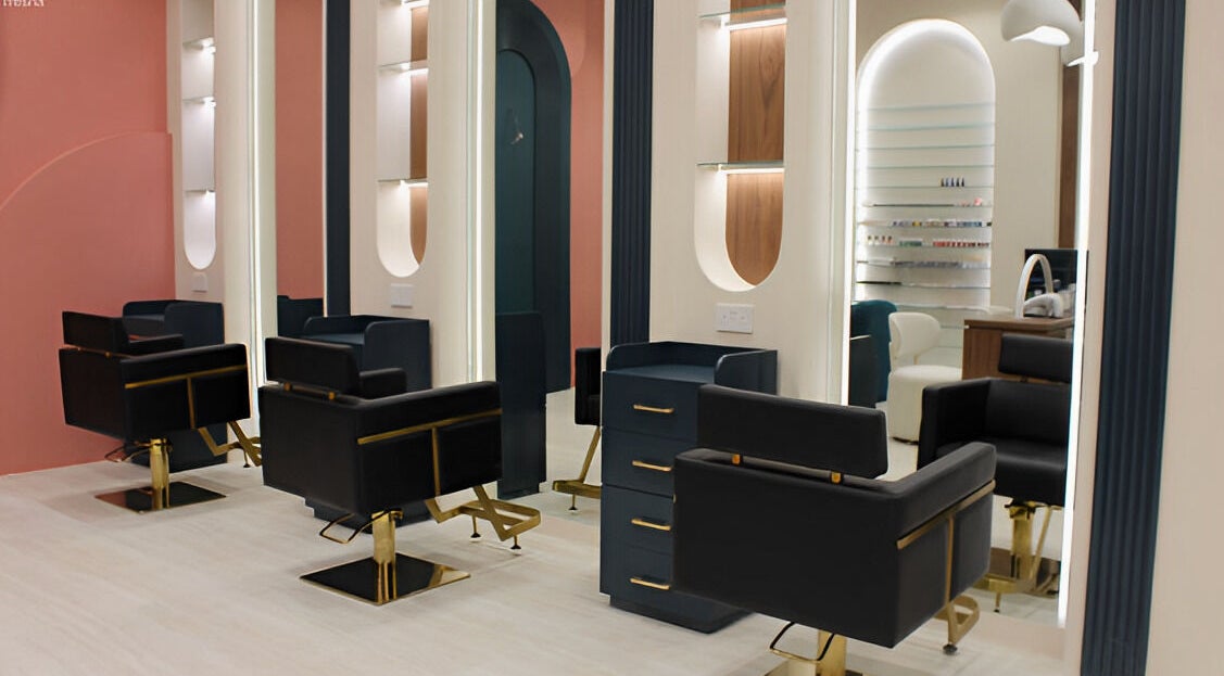 Modern interior of Elysian Salon in Riyadh features chic black chairs and elegant decor.