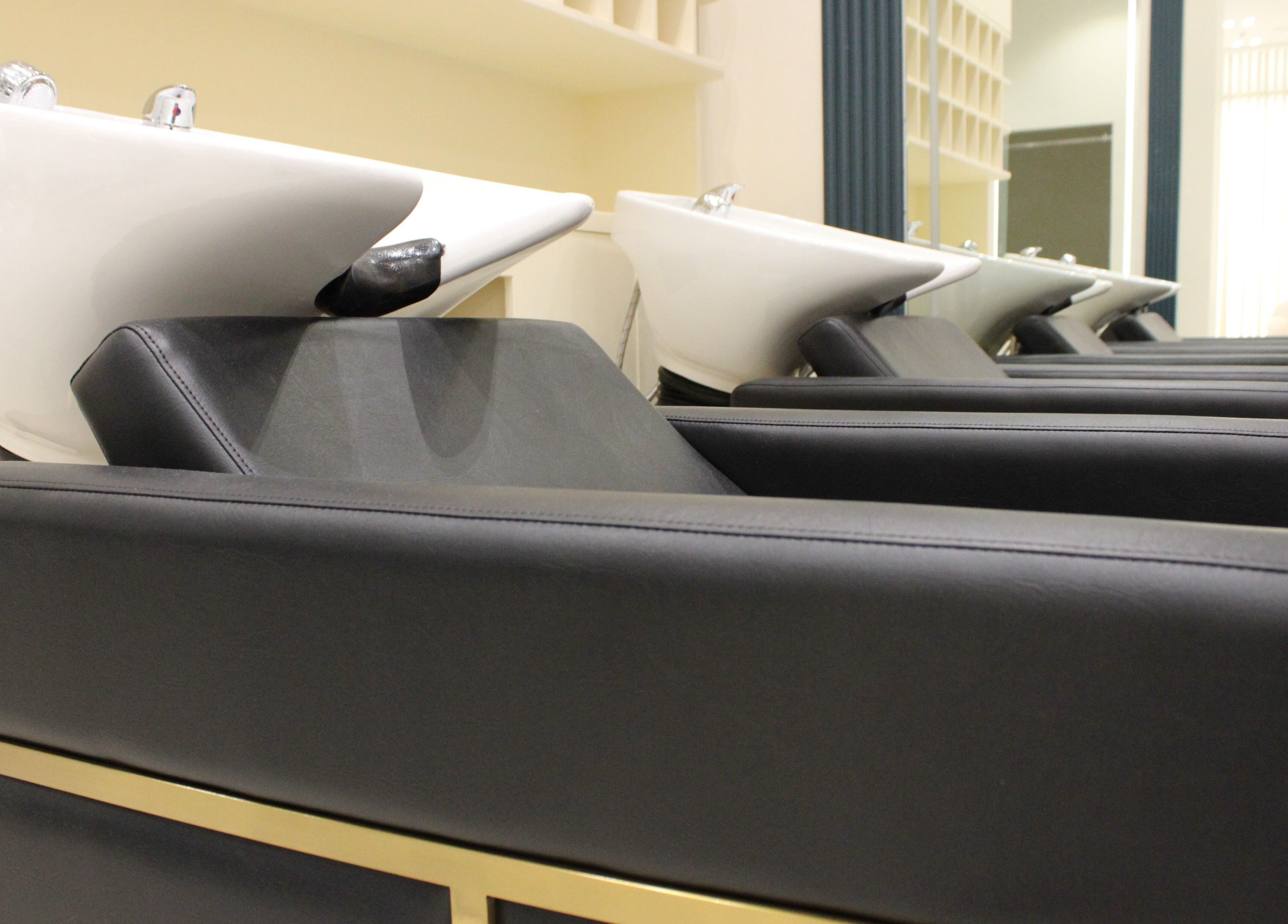 Modern wash stations at Elysian Salon in Riyadh, Riyadh Province, SA, offering premium haircut services.