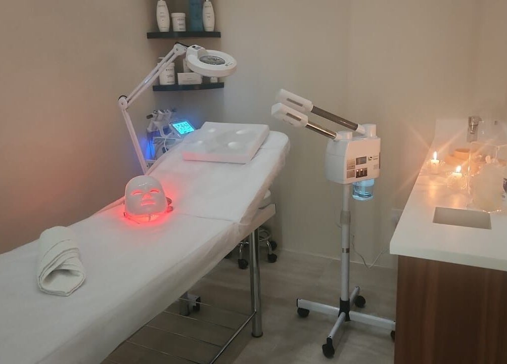 Spa room at Elysian Salon in Riyadh, Riyadh Province, SA with facial mask and treatment table.