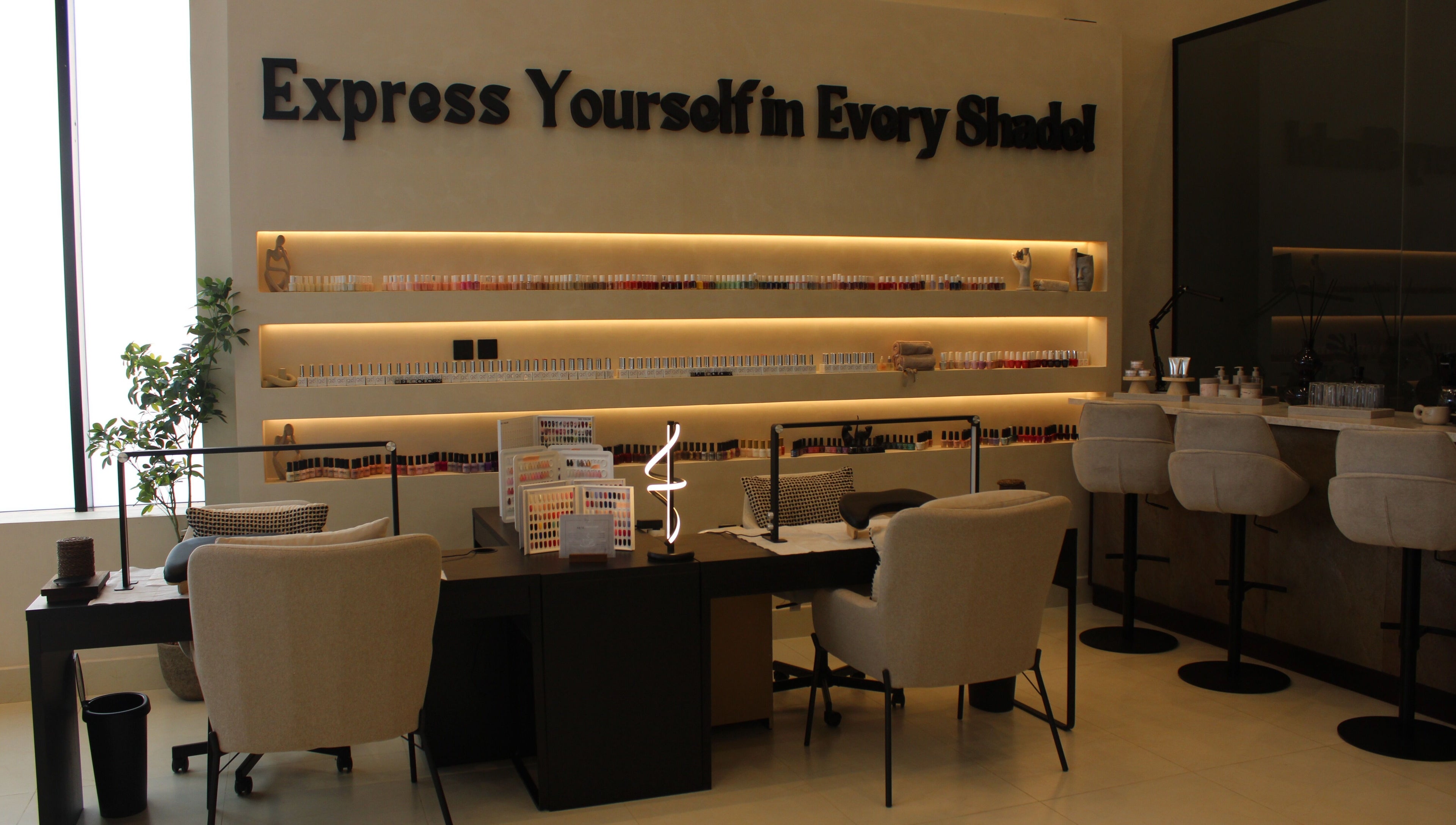 Elegant nail station at Raya Spa, Riyadh, Riyadh Province, SA, showcasing a variety of nail polishes.