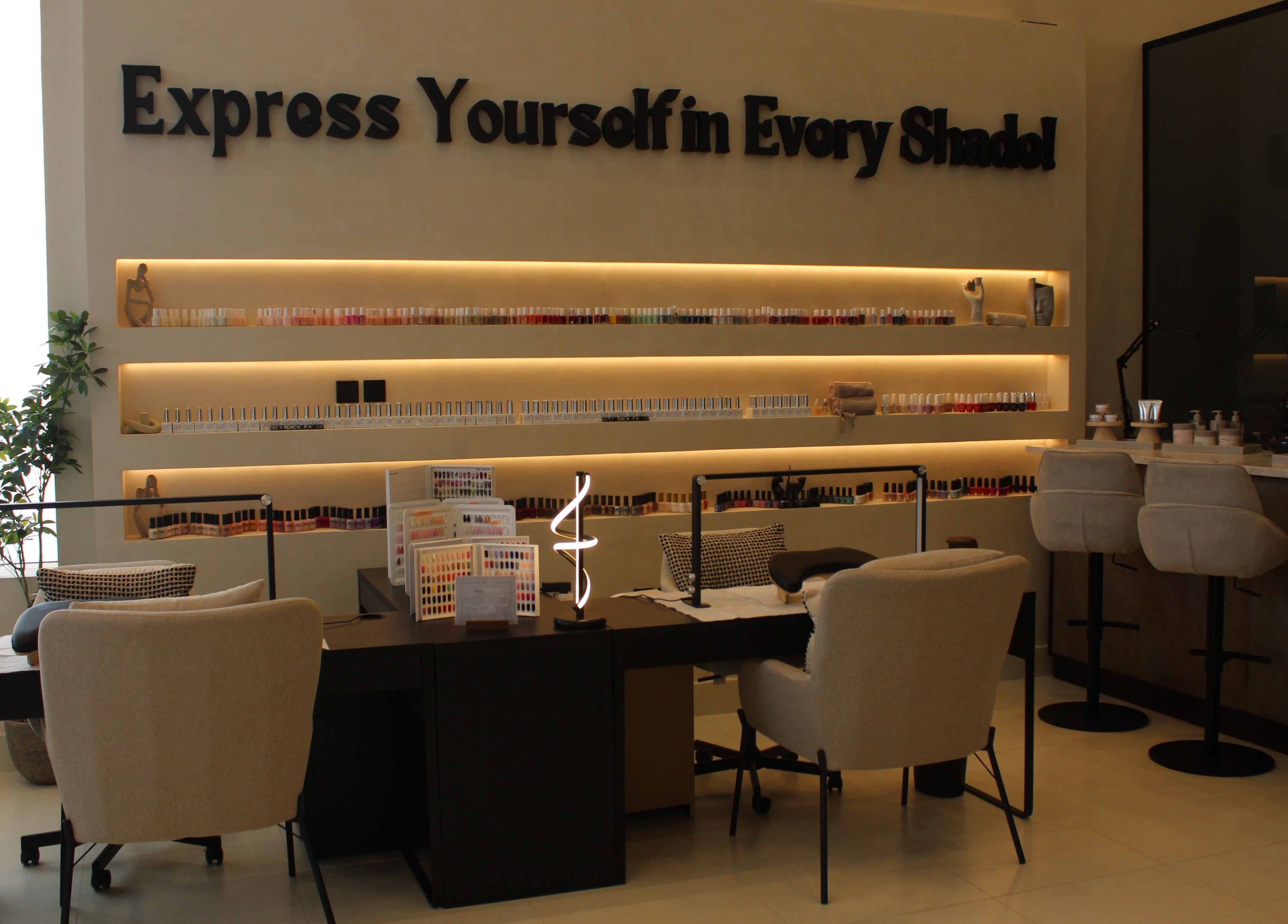 Elegant nail station at Raya Spa, Riyadh, Riyadh Province, SA, showcasing a variety of nail polishes.