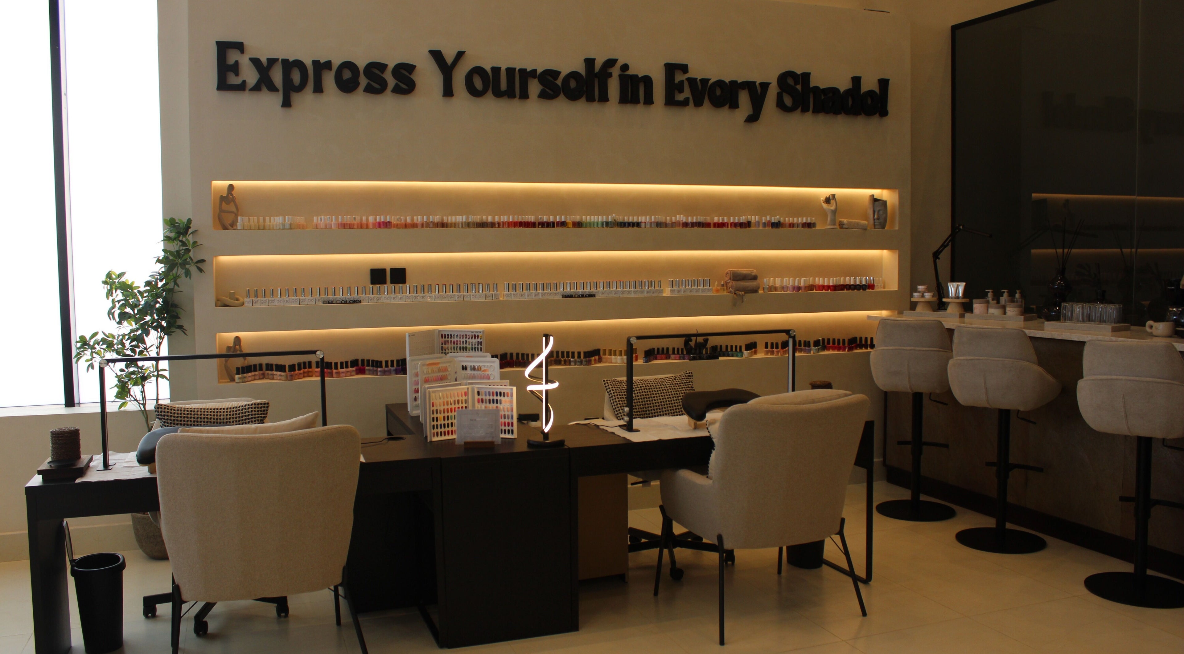 Elegant nail station at Raya Spa, Riyadh, Riyadh Province, SA, showcasing a variety of nail polishes.