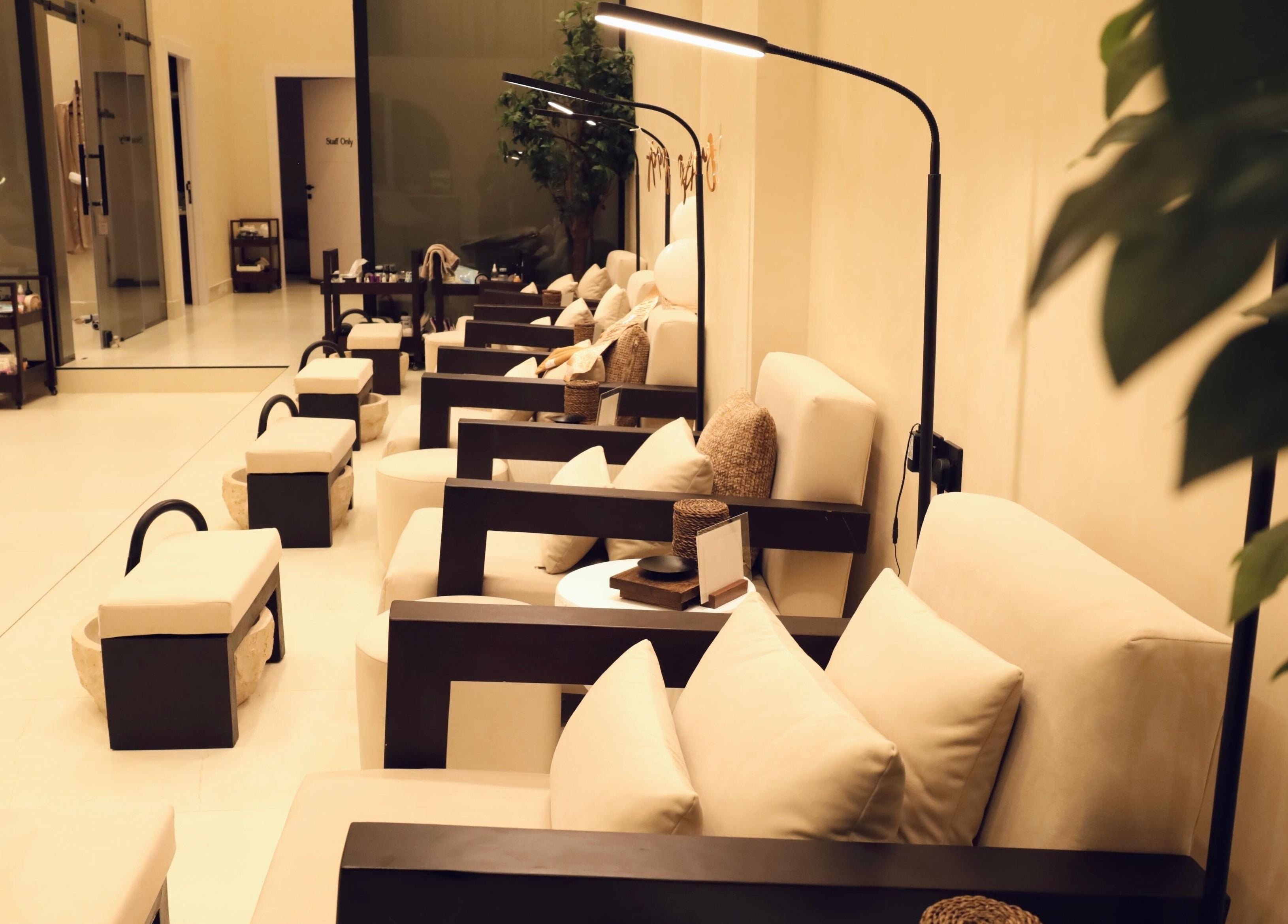 Relaxing seating area at Raya Spa in Riyadh, Riyadh Province, SA, featuring soft lighting and comfortable chairs.