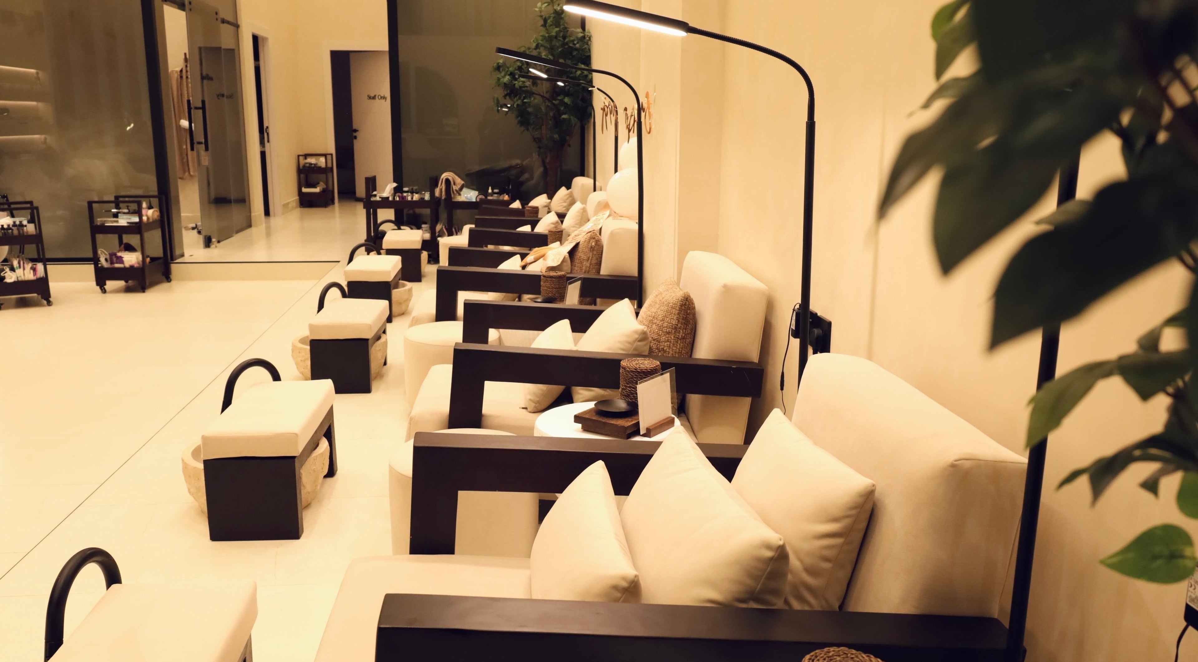 Relaxing seating area at Raya Spa in Riyadh, Riyadh Province, SA, featuring soft lighting and comfortable chairs.