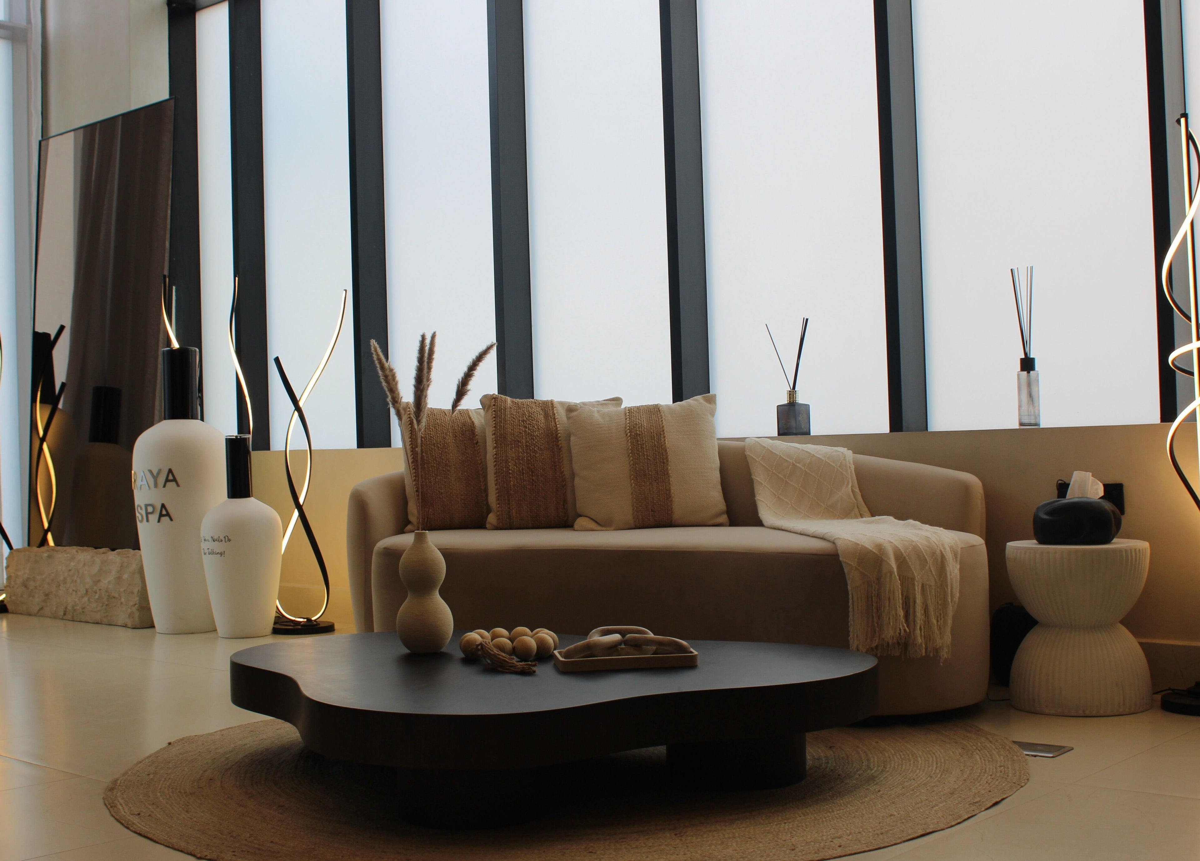 Relaxing lounge at Raya Spa, Riyadh, Riyadh Province, SA, featuring cozy seating and ambient lighting.