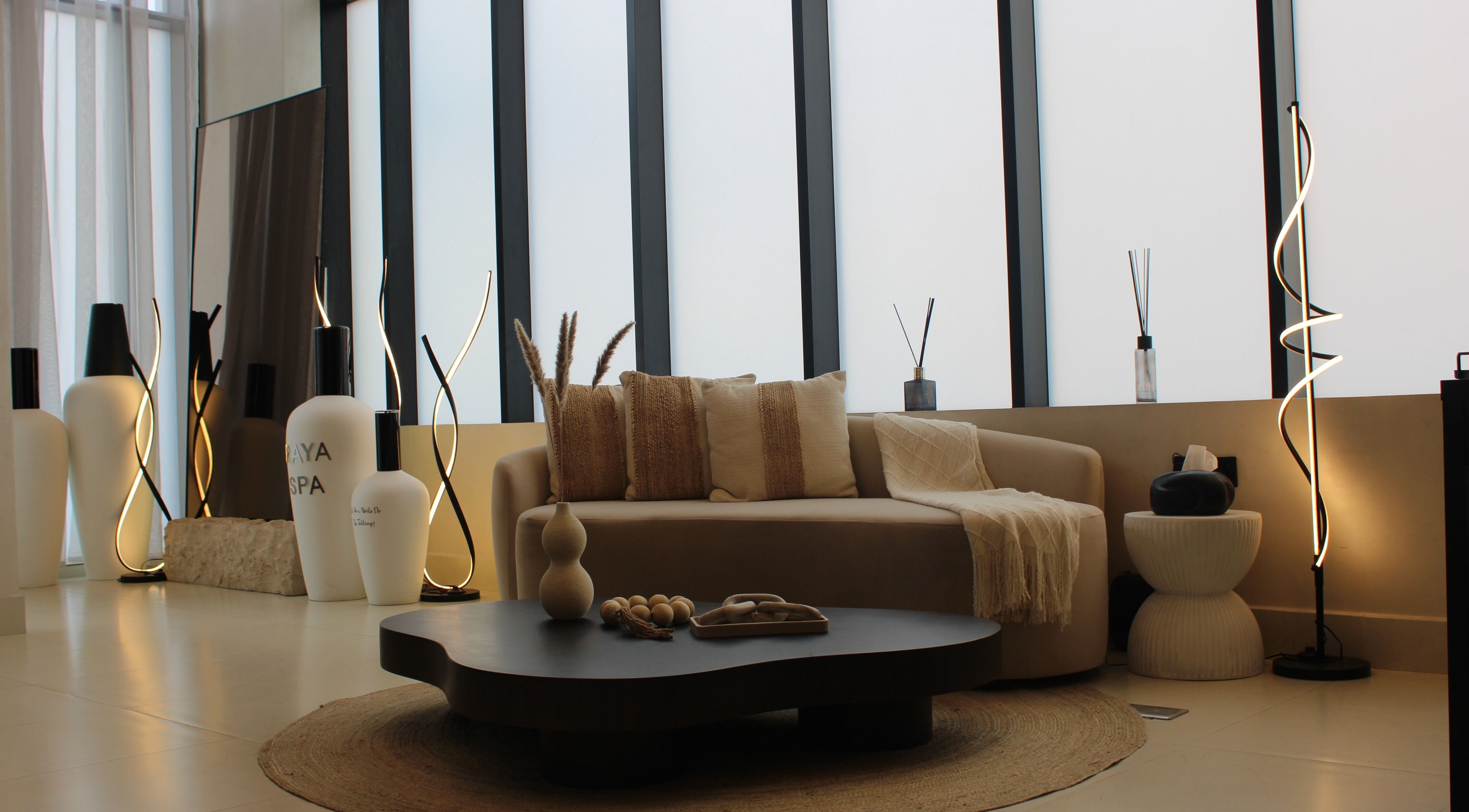 Relaxing lounge at Raya Spa, Riyadh, Riyadh Province, SA, featuring cozy seating and ambient lighting.