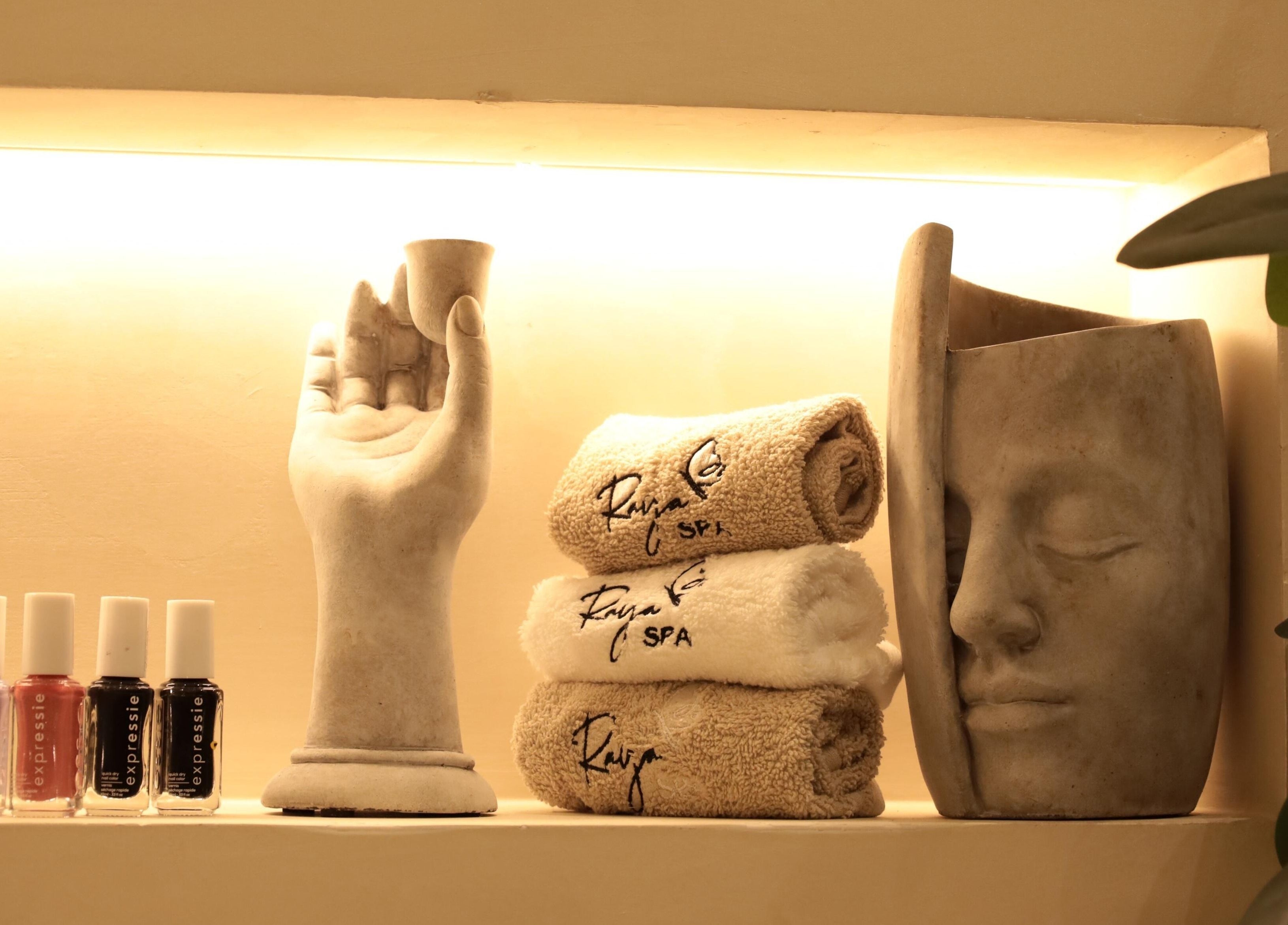 Beautiful decor with towels and nail polish at Raya Spa, Riyadh, Riyadh Province, SA for a relaxing ambiance.
