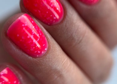 Close-up of vibrant pink nails at Nail_House_by_Ilze, Rīga, LV, showcasing expert manicure.