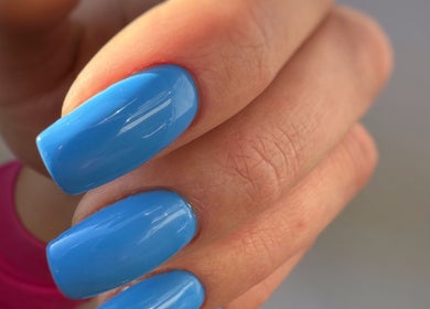 Vibrant sky blue nails manicured at Nail_House_by_Ilze, Rīga, LV, showcasing stunning nail art.