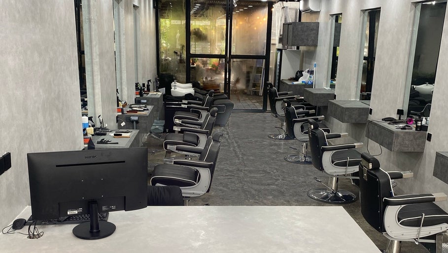 Modern barber chairs at The Barber Club Bali, Denpasar, ID with sleek interior design.