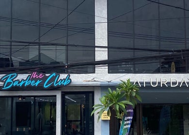 Front of The Barber Club Bali, Denpasar, ID, showcasing modern facade and signage.