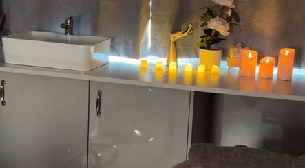 Relaxing candles and sink at The Glow Room, York, England, GB create a tranquil ambiance.