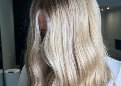 Blonde hair styled in sleek waves at Beau.Te Hair & Co, Melbourne, Victoria, AU.