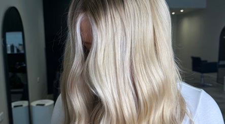 Blonde hair styled in sleek waves at Beau.Te Hair & Co, Melbourne, Victoria, AU.