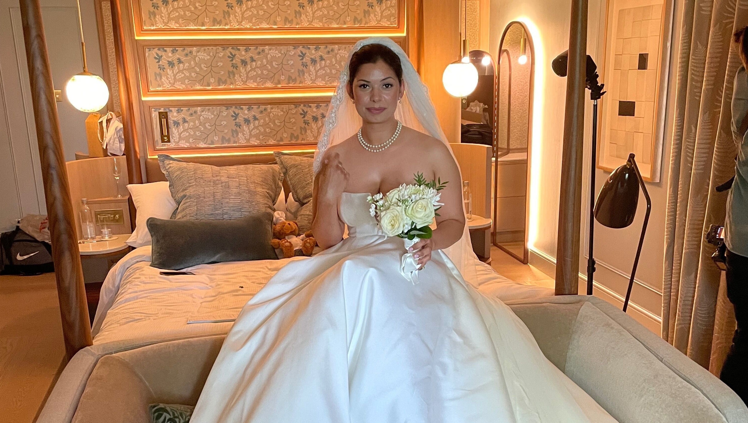 Bride in gown at Lisa Critchley Makeup Artist studio, Abbots Langley, England, GB.