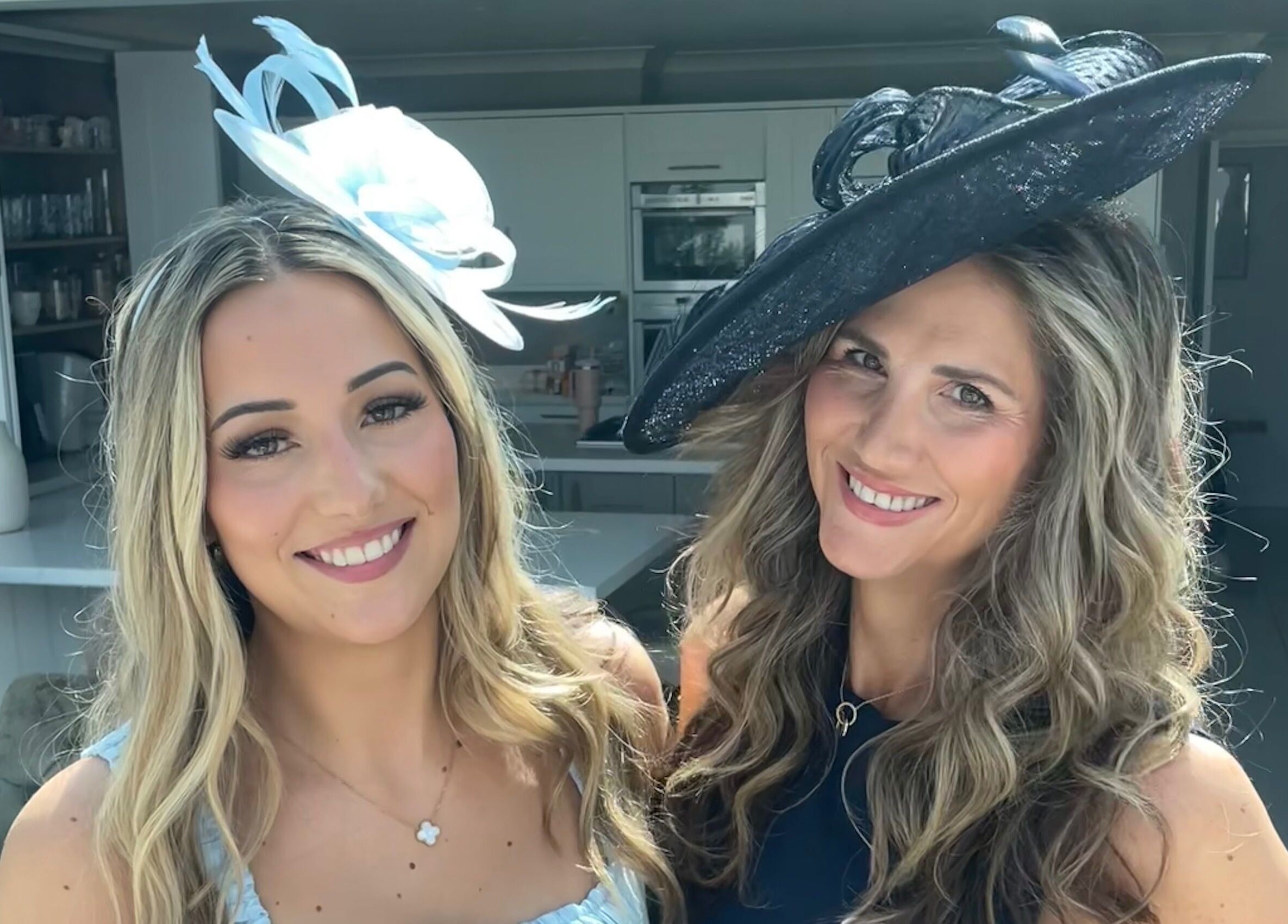 Two women in stylish hats at Lisa Critchley Makeup Artist, Abbots Langley, England, GB.