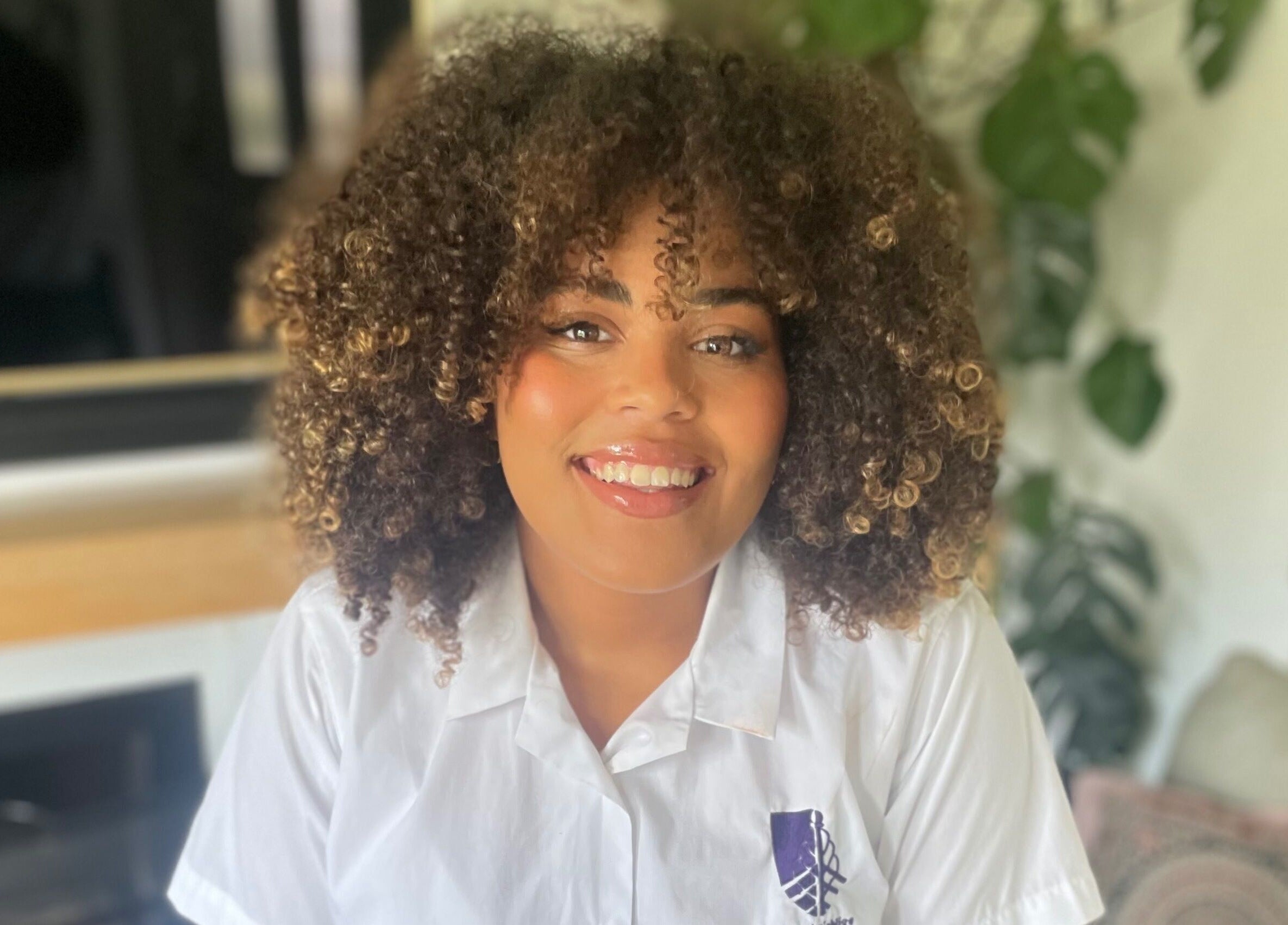 A happy client with styled curls at Lisa Critchley Makeup Artist, Abbots Langley, England, GB.