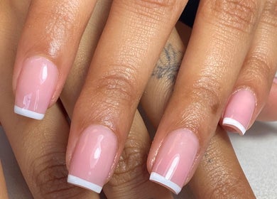 French manicure at Biromi Nails & Beauty, Boksburg, Gauteng, ZA shows glossy pink nails with white tips.