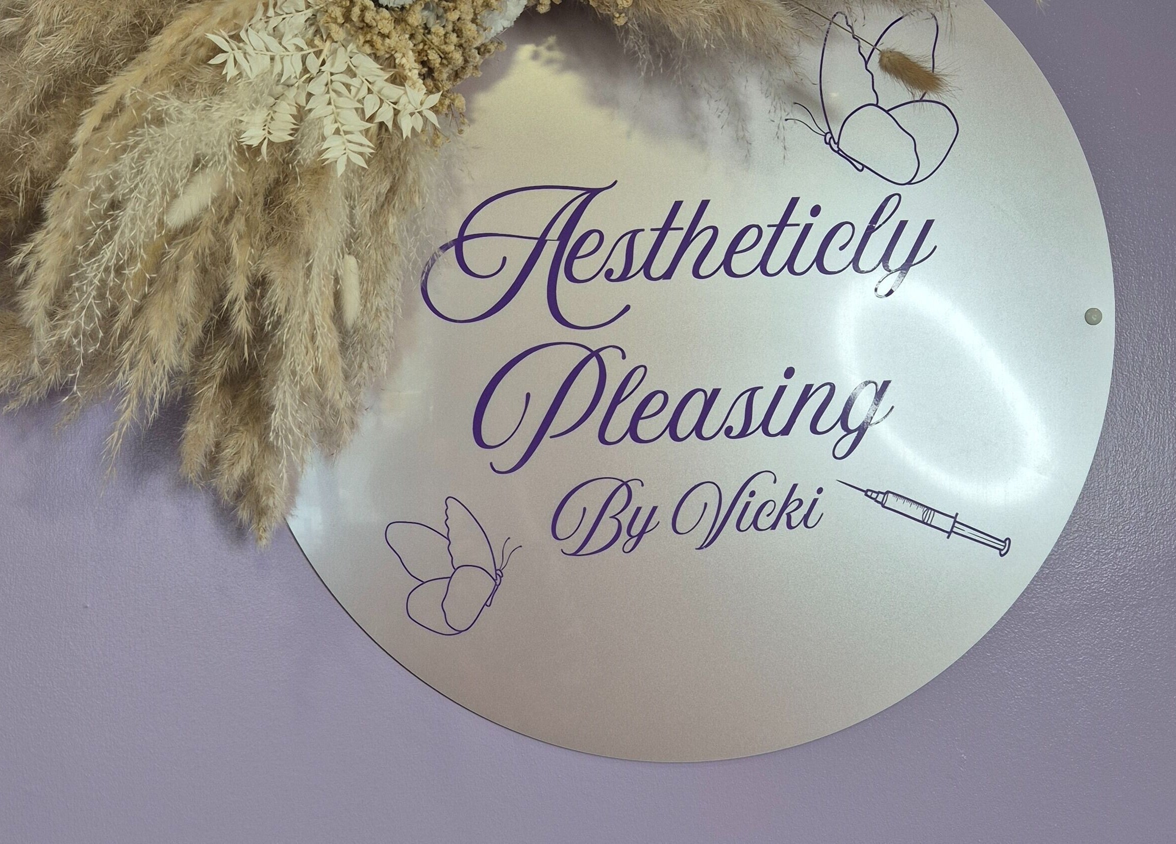 Sign with pampas grass at Aestheticly Pleasing By Vicki, Rutherglen, Scotland, GB.