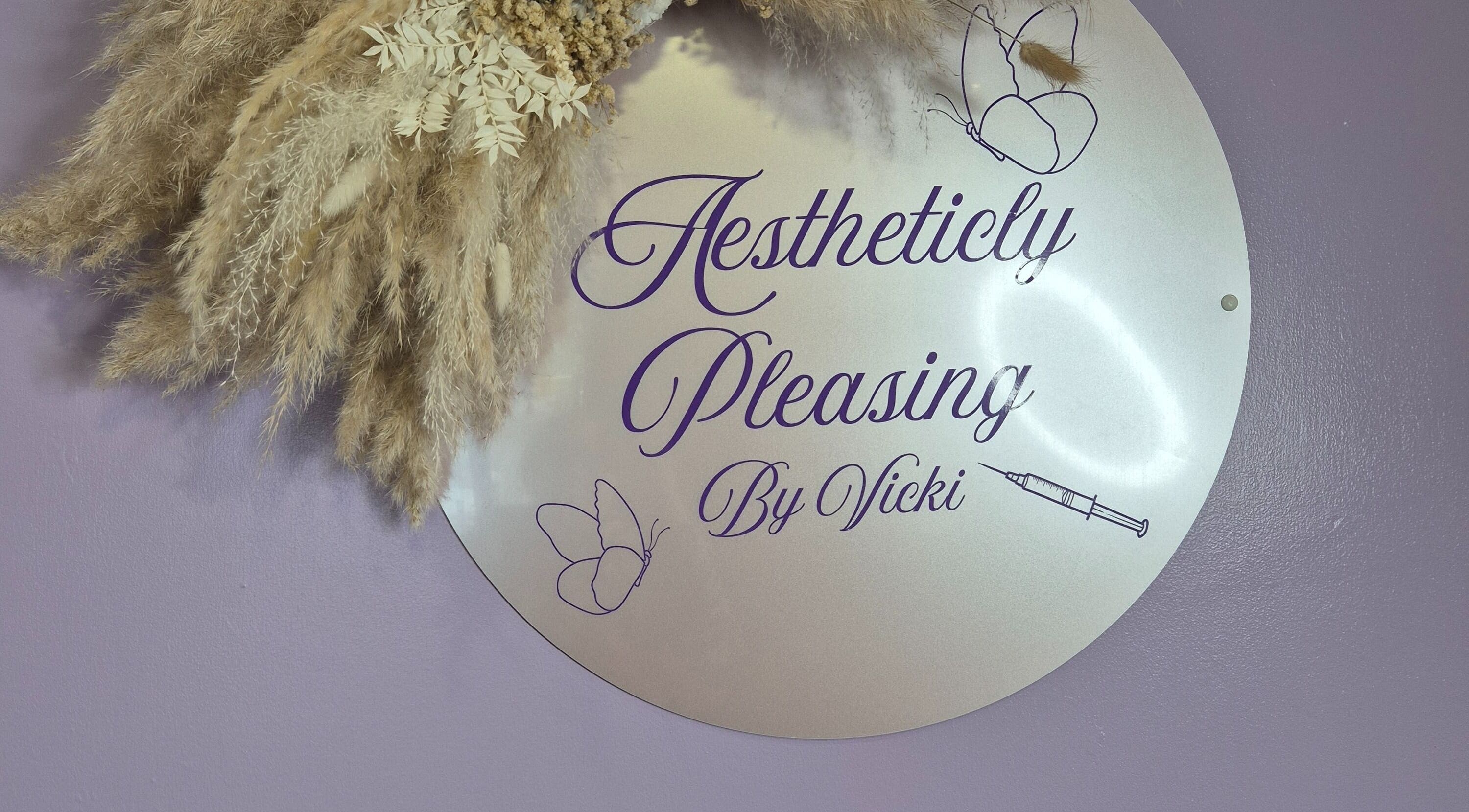 Sign with pampas grass at Aestheticly Pleasing By Vicki, Rutherglen, Scotland, GB.