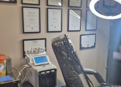 Aestheticly Pleasing By Vicki in Rutherglen, Scotland: serene spa room with equipment and certificates displayed.