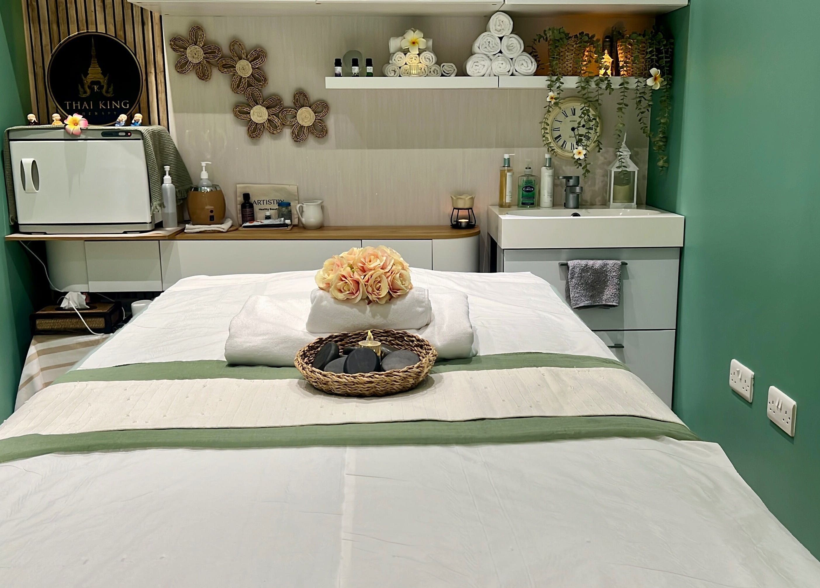 Calming massage room at THAI KING THERAPY MASSAGE in Reading, England, GB with a neatly arranged spa bed.