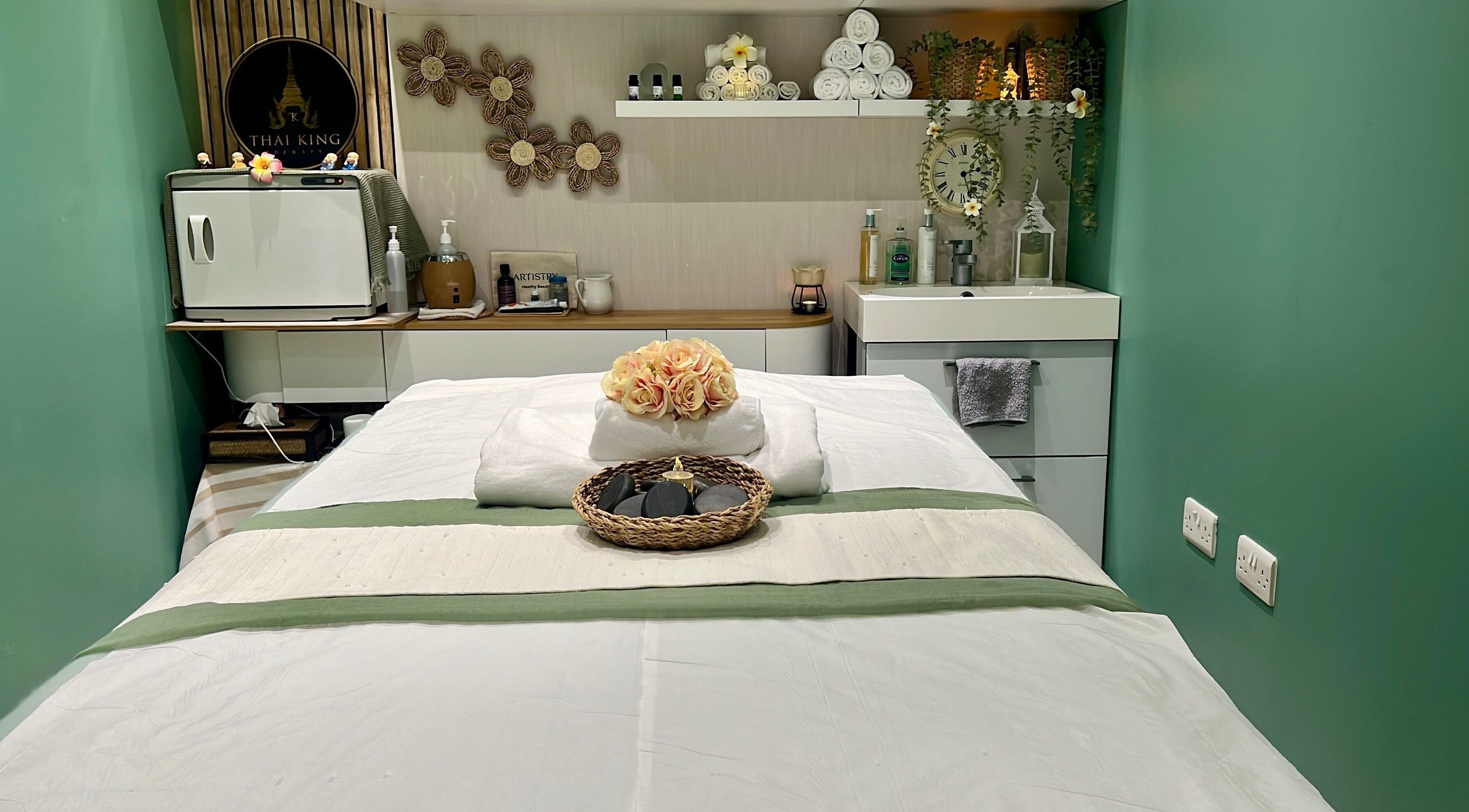 Calming massage room at THAI KING THERAPY MASSAGE in Reading, England, GB with a neatly arranged spa bed.