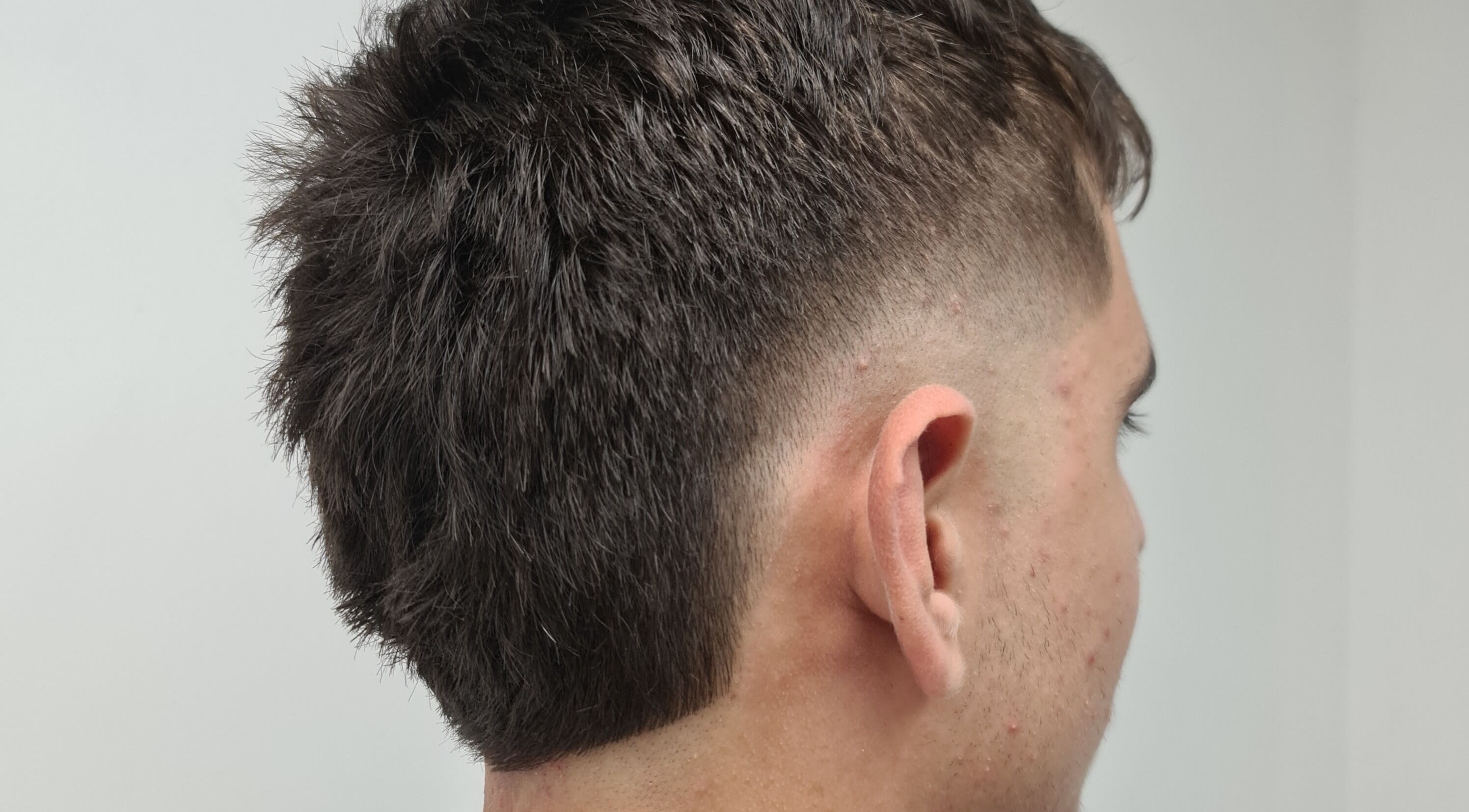 Close-up of a trendy fade haircut at Go See Dave in Wakeley, New South Wales, AU.