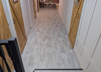 Elegant hallway at L'abeille Hair & Beauty in Halifax, England, GB with stylish décor and ambient lighting.