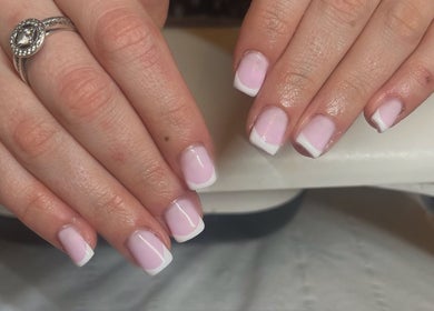 Elegant French manicure at Glam By TAM, Stevenage, England, GB showcasing polished pink nails with white tips.