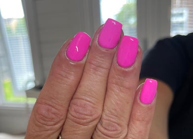 Vibrant pink manicure at Glam By TAM, Stevenage, England, GB. Perfect for a bold look.