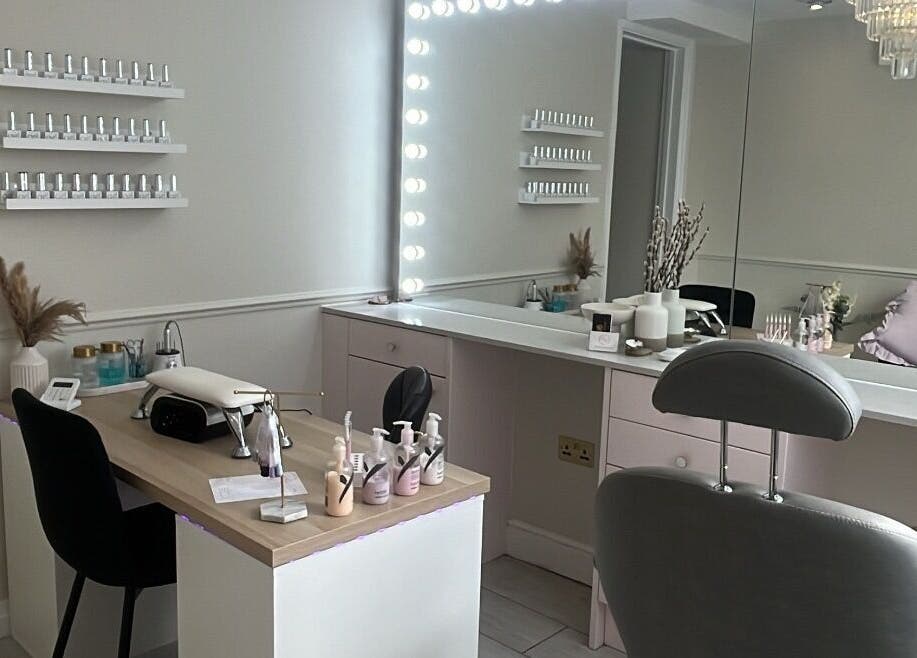 Modern beauty station at Glam By TAM, Stevenage, England, GB with chic decor and illuminated mirror.