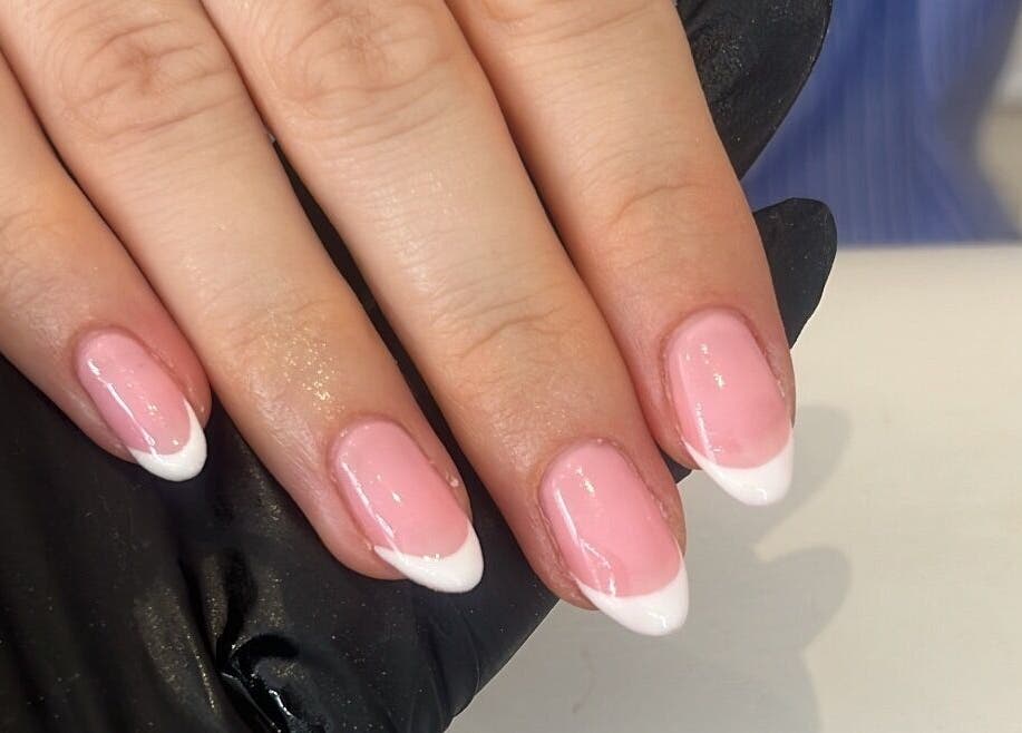 Elegant French manicure at Glam By TAM, Stevenage, England, GB, showcasing precision and style.