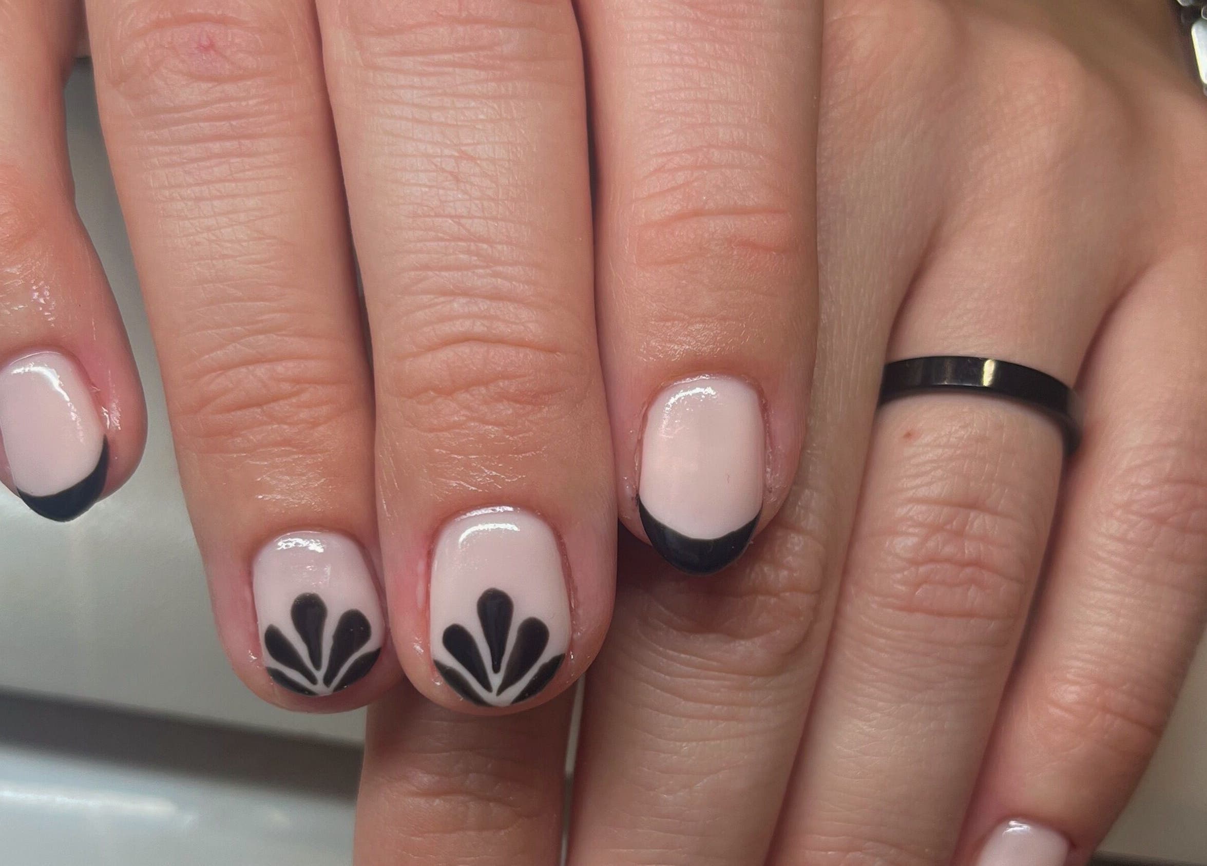 Chic black and pink nail art at Glam By TAM, Stevenage, England, GB. Perfect manicure showcasing skillful design.