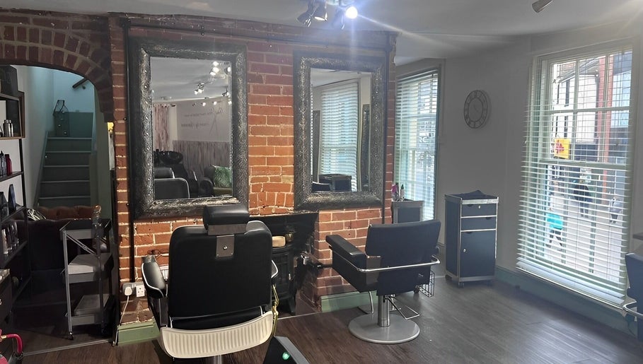 The Stock Room Hair & Beauty salon interior, featuring stylish chairs and mirrors in Norwich, England, GB.