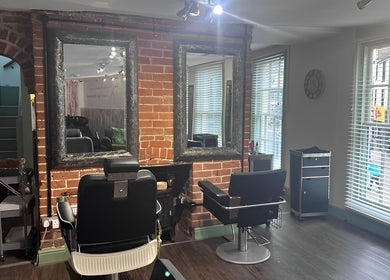 The Stock Room Hair & Beauty salon interior, featuring stylish chairs and mirrors in Norwich, England, GB.