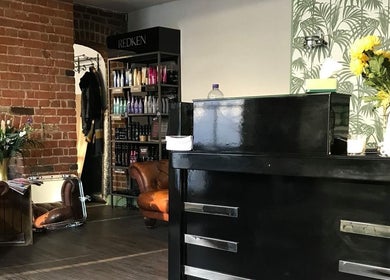 Elegant interior of The Stock Room Hair & Beauty, Norwich, England, GB featuring stylish decor and products.