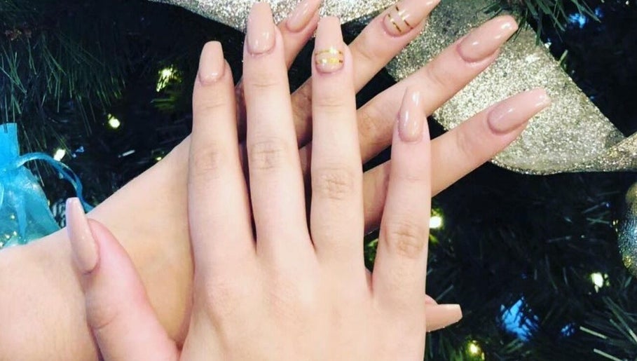 Freshly manicured hands with neutral polish at Momo Nail Spa, Fort Lauderdale, Florida, US.