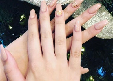 Freshly manicured hands with neutral polish at Momo Nail Spa, Fort Lauderdale, Florida, US.