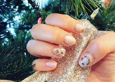 Beautifully decorated festive nails at Momo Nail Spa, Fort Lauderdale, Florida, US, with holiday-themed designs.