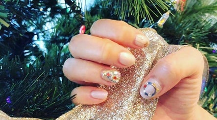Beautifully decorated festive nails at Momo Nail Spa, Fort Lauderdale, Florida, US, with holiday-themed designs.