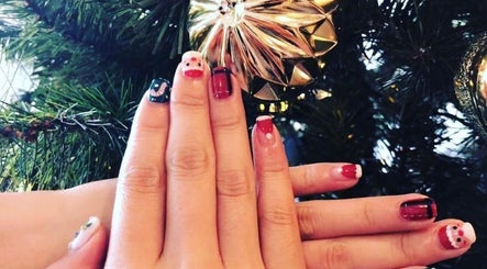 Festive nail art at Momo Nail Spa, Fort Lauderdale, Florida, US, featuring holiday designs and vibrant colors.
