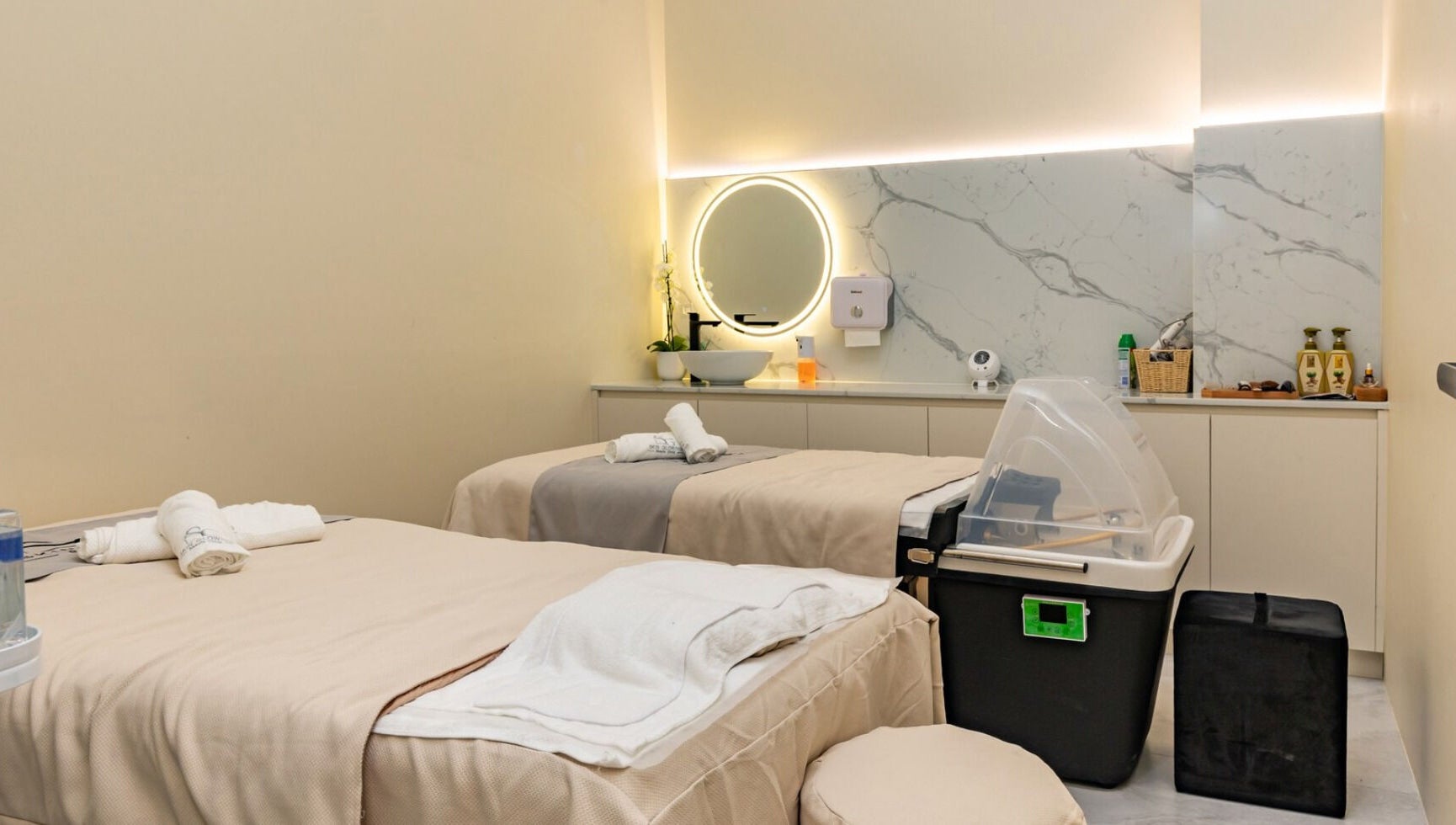 Elegant spa treatment room at Skin Glowing Zetland, Zetland, New South Wales, AU, featuring two massage beds.