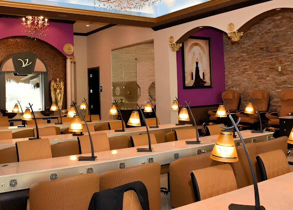 Luxurious seating area in Venetian Nail Spa, Daytona Beach, Florida, US with stylish decor and warm lighting.