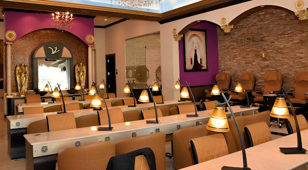 Luxurious seating area in Venetian Nail Spa, Daytona Beach, Florida, US with stylish decor and warm lighting.