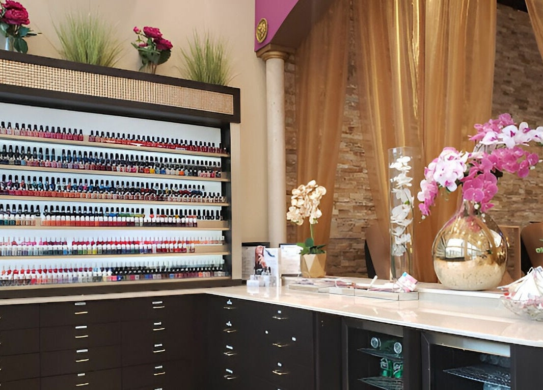 Venetian Nail Spa's elegant nail polish display in Daytona Beach, Florida, US, with vibrant floral decor.