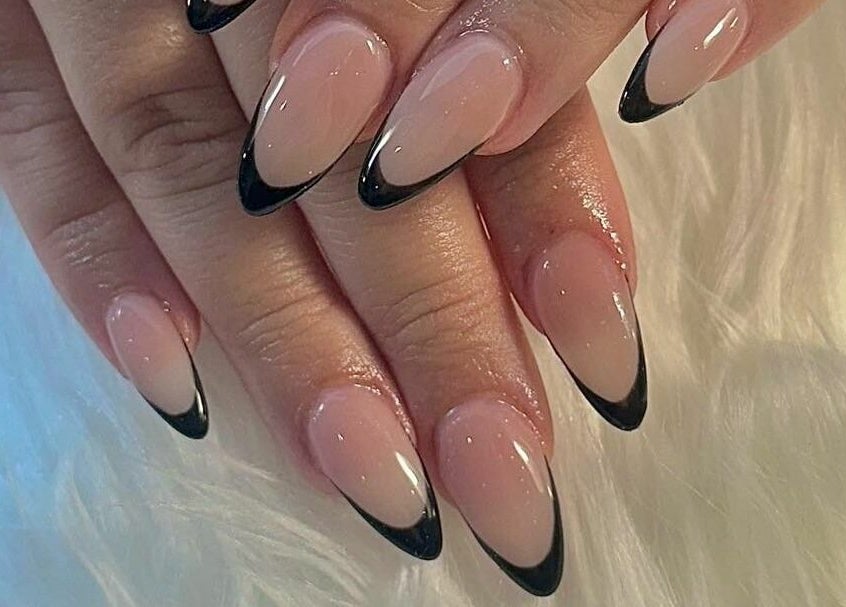 Chic black French manicure at Venetian Nail Spa, Daytona Beach, Florida, US, showcasing style and elegance.