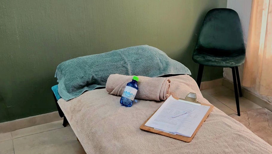Cozy massage setup at Calmm Massage in Sandton, Gauteng, ZA featuring soft towels and relaxation essentials.