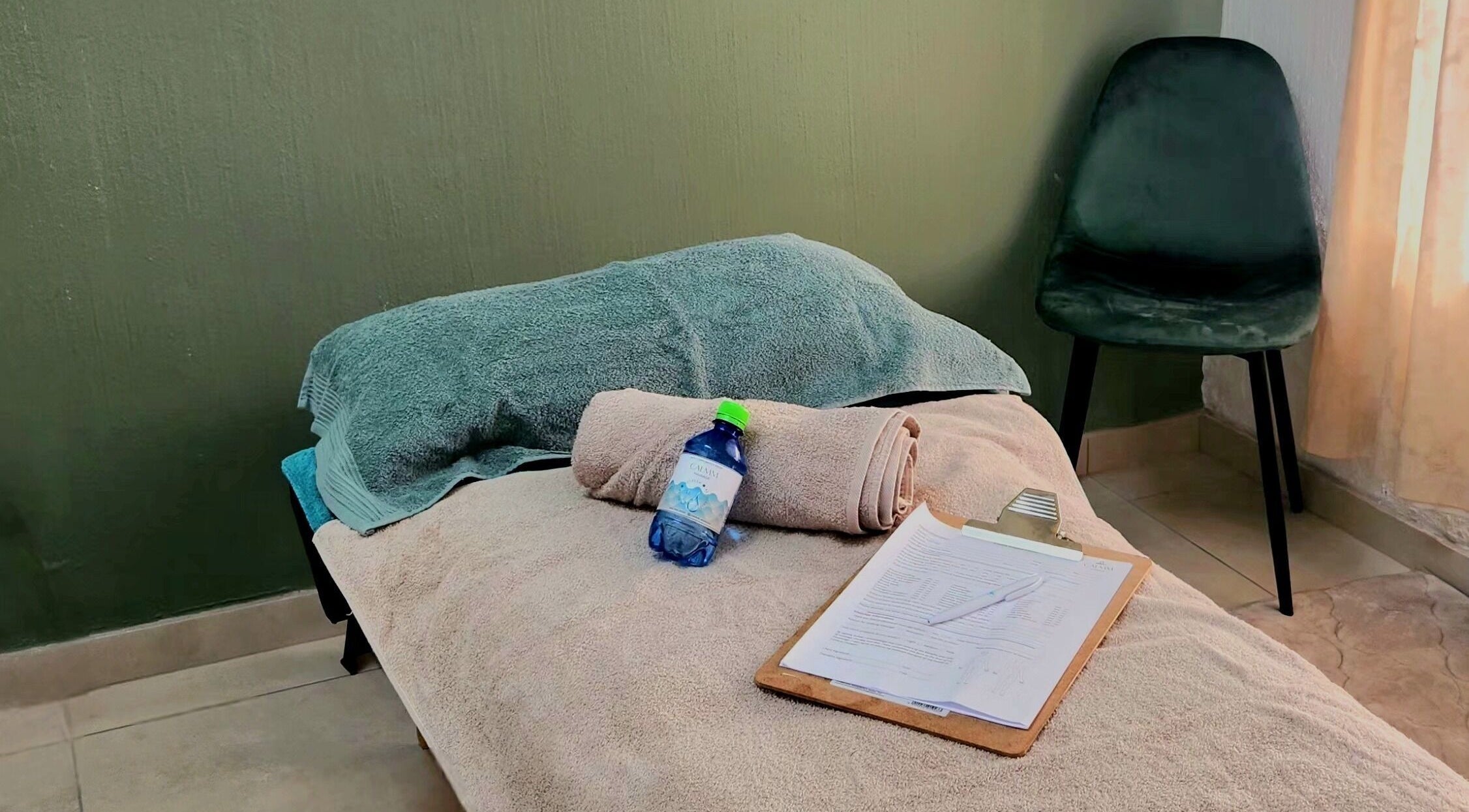 Cozy massage setup at Calmm Massage in Sandton, Gauteng, ZA featuring soft towels and relaxation essentials.